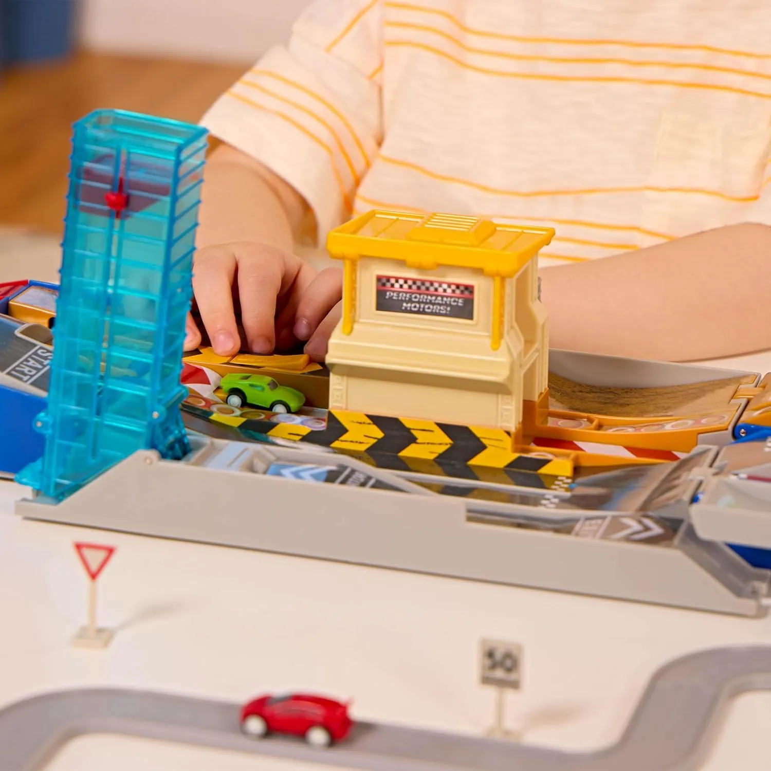 Driven by Battat - 80-Piece Race Track & Auto Shop Playset with Mini Cars - Kids Toys Collapsible Set with Elevator, Road Signs & Multiple Racing Routes - Interactive Vehicle Track System for Ages 3 
