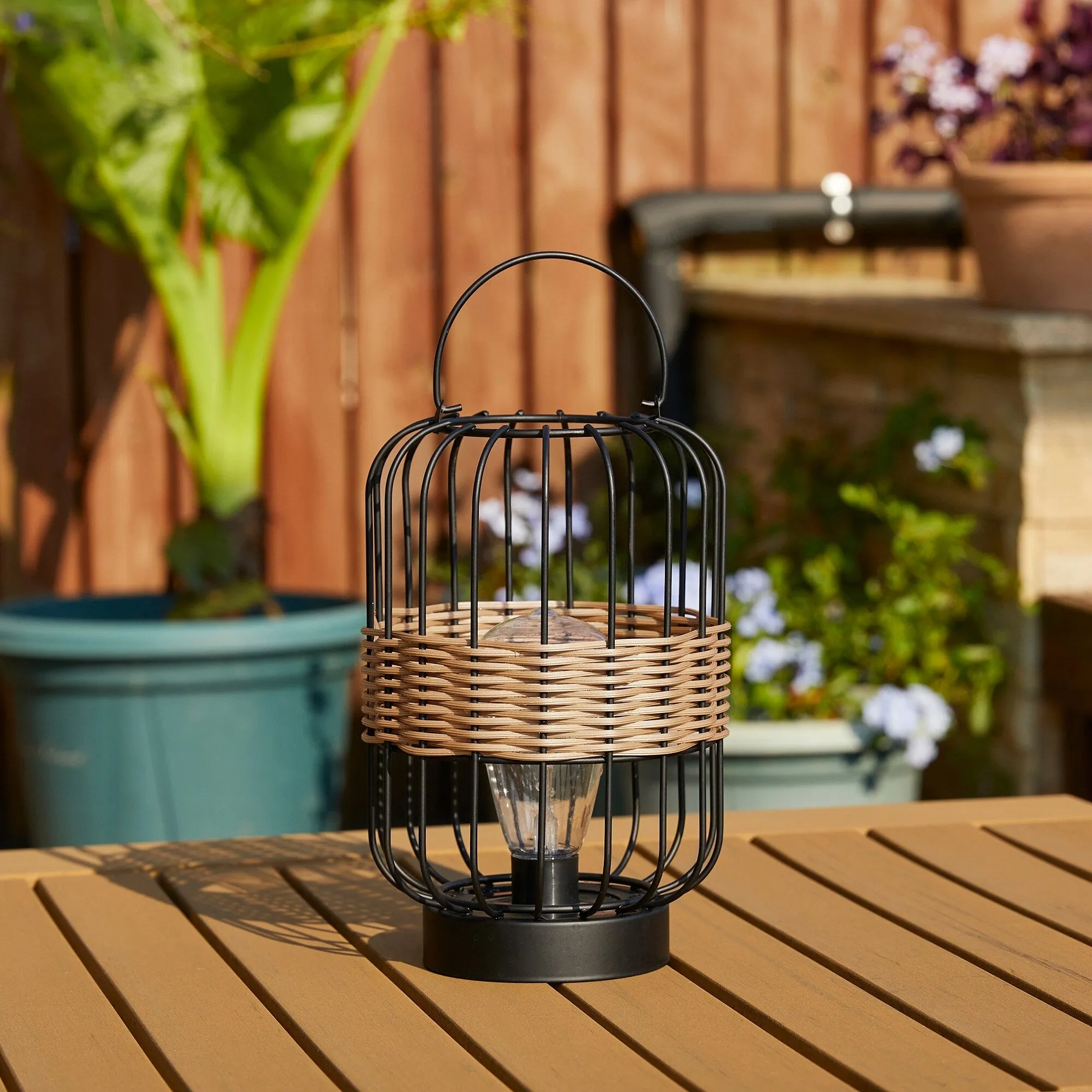 Glitzhome 11.75"H Metal & Faux Rattan Solar Powered Outdoor Lantern with Edison Bulb