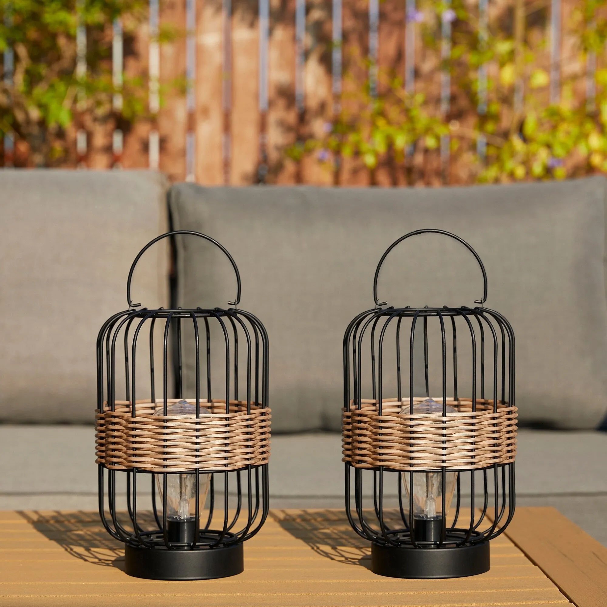 Glitzhome 11.75"H Metal & Faux Rattan Solar Powered Outdoor Lantern with Edison Bulb