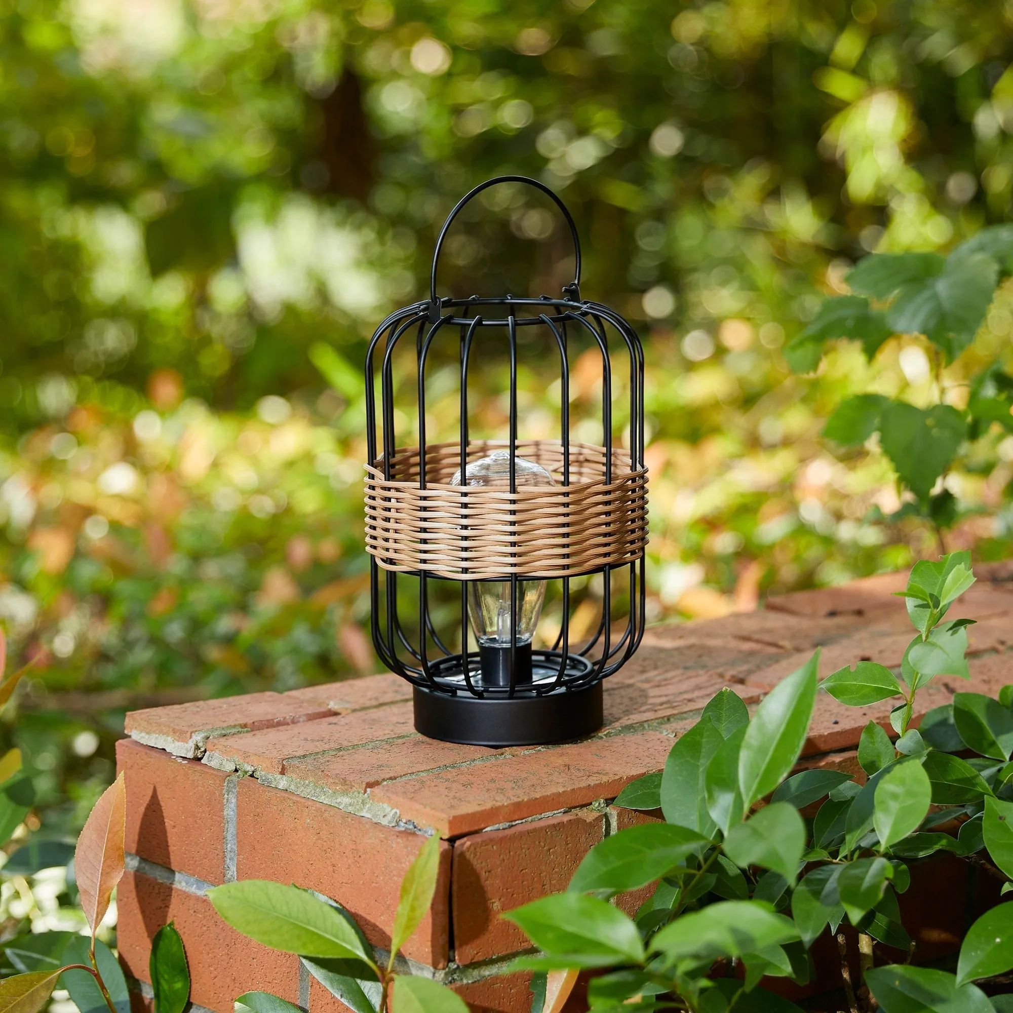 Glitzhome 11.75"H Metal & Faux Rattan Solar Powered Outdoor Lantern with Edison Bulb