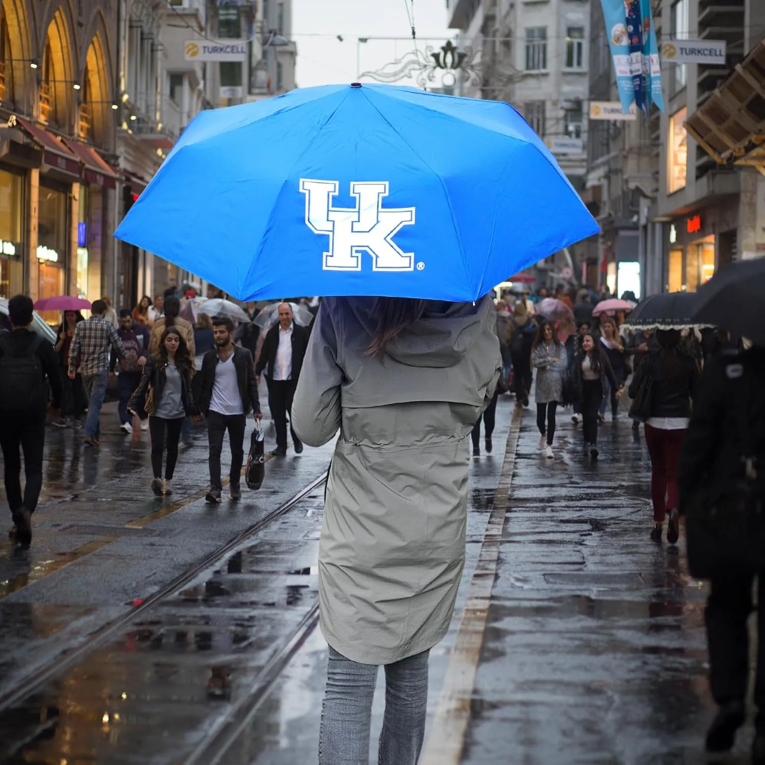 Mini Compact Storm Umbrella - NCAA Logo 42” Coverage, Folds to 11 Inches- Swivel Clip on Handle - Water, Wind & Rust Resistant, and Flexible Frame